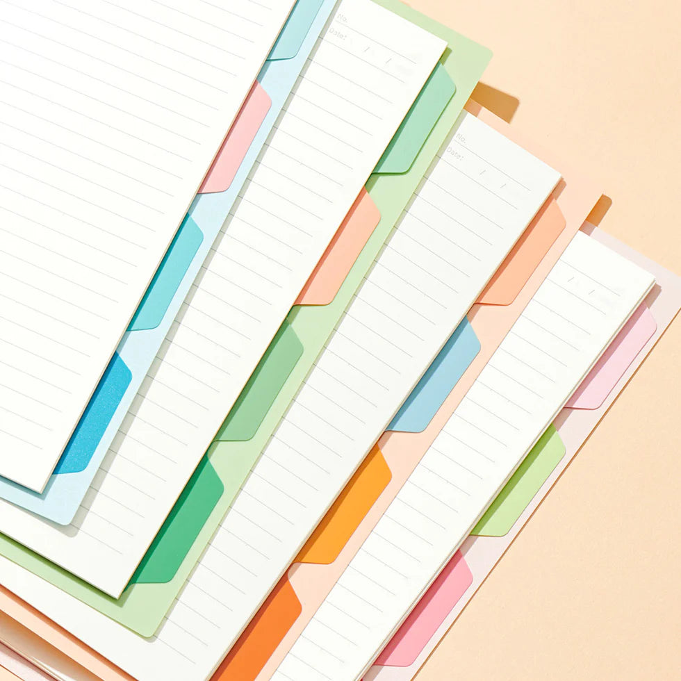 Colorful index cards with tabs on a light background