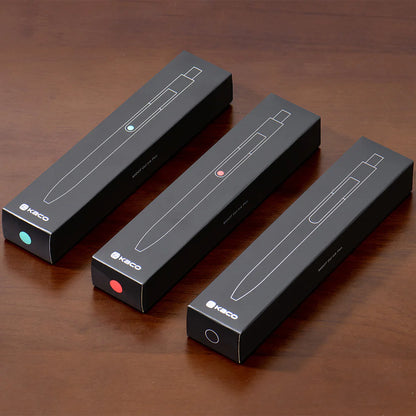 Three black Kaco pen boxes on a wooden surface