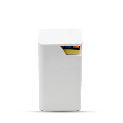 White rectangular container with colorful items inside on a white background