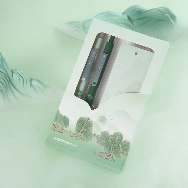 Green pen in a transparent packaging on a light green background