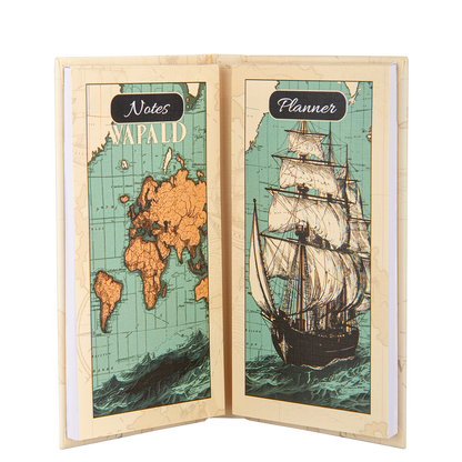 Open notebook with world map and ship design on a white background
