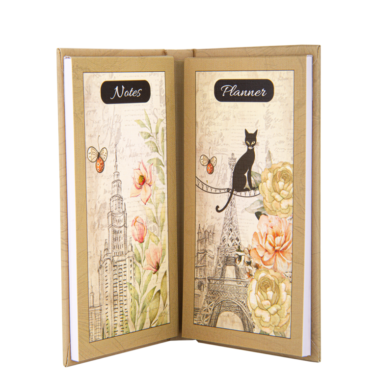 Open notebook with 'Notes' and 'Planner' labels, featuring cityscape and cat illustrations on a white background.