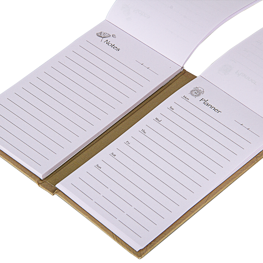 Open notebook with lined pages labeled 'Notes' and 'Planner' on a white background