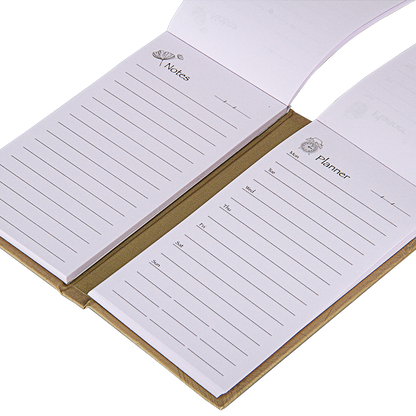Open notebook with lined pages labeled 'Notes' and 'Planner' on a white background