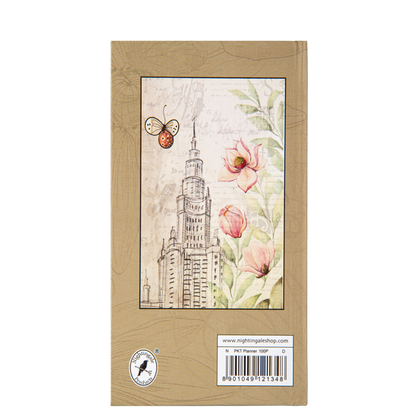 Packaging of a planner with floral and architectural design on a beige background