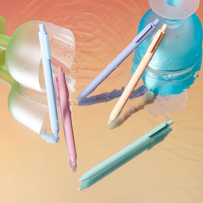 Colorful pens on a water droplet background