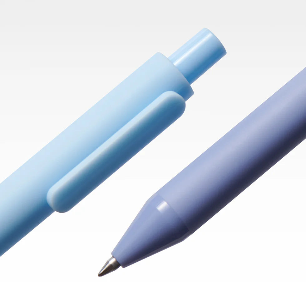 Two light blue pens on a white background