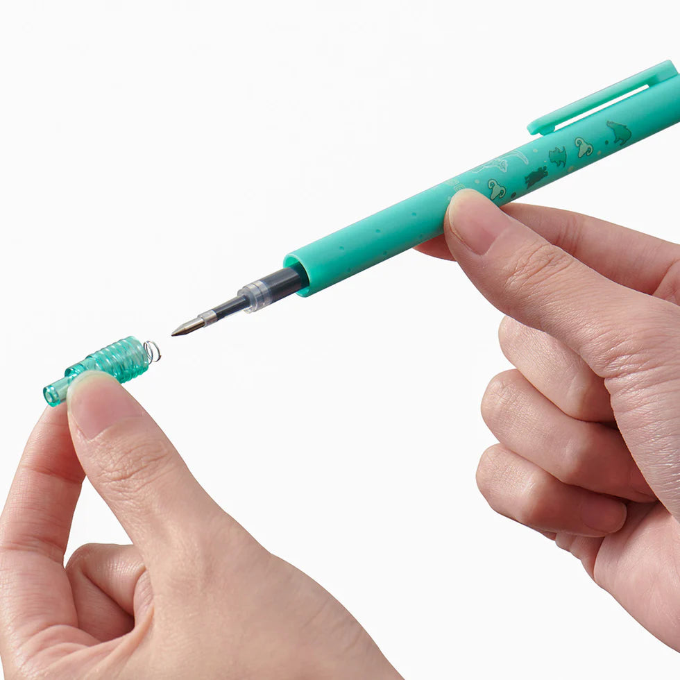 Turquoise pen being held with a hand, showing the mechanism on a white background