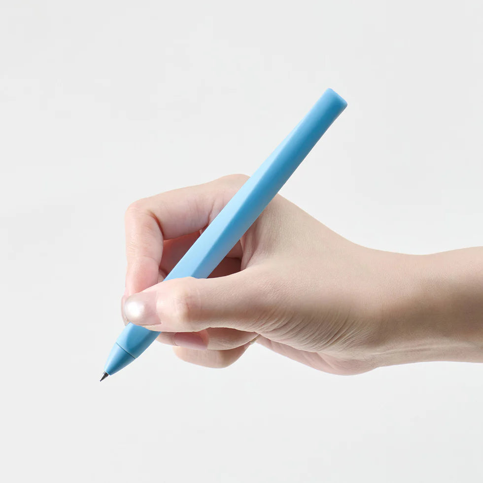 Hand holding a blue stylus pen on a light gray background