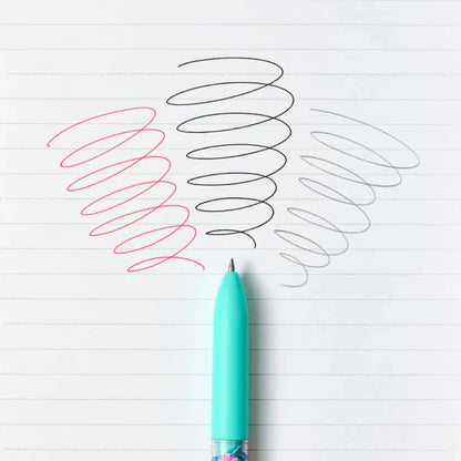 Turquoise pen with colorful design on a white background with spiral lines.