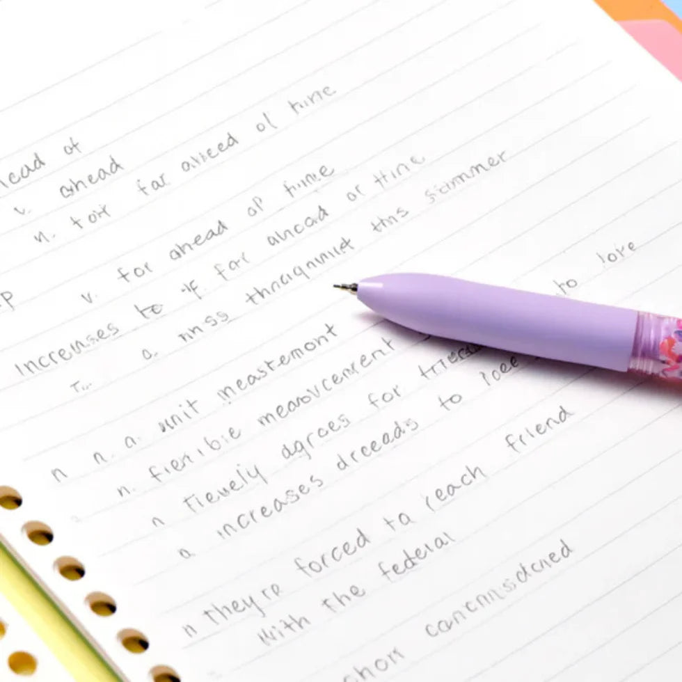 Purple pen on a notebook with handwritten text