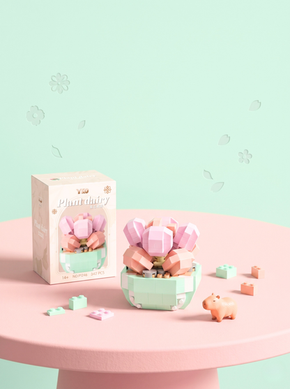 Pastel-colored toy set with packaging on a pink table against a light green background