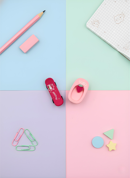 Stationery items including a pencil, eraser, and colorful paper clips on a pastel grid background.