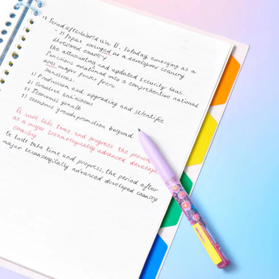 Colorful pen on a notebook with text