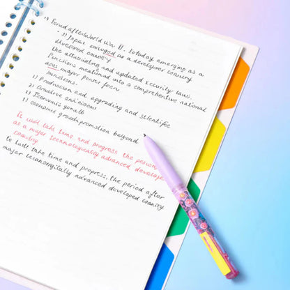 Colorful pen on a notebook with text