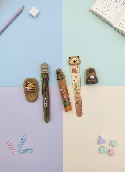 Stationery items including a pen, ruler, and eraser on a two-tone background