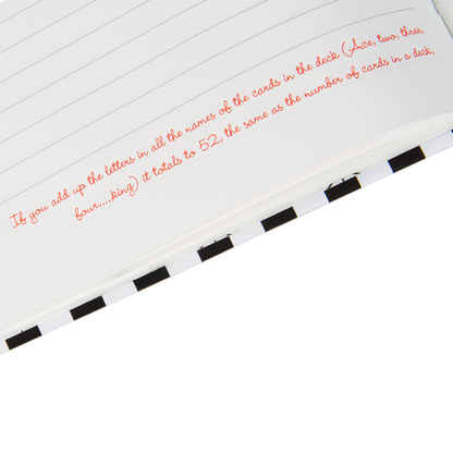 Close-up of a card with text and a black and white striped border