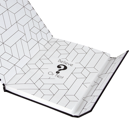 Open notebook with geometric pattern and 'Believe Or Not?' text on white background