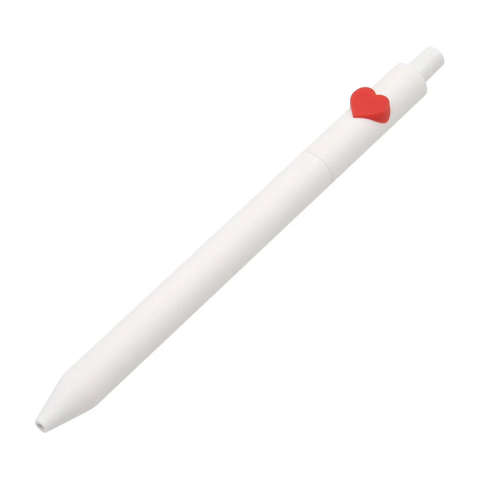 White pen with a red heart-shaped clip on a white background