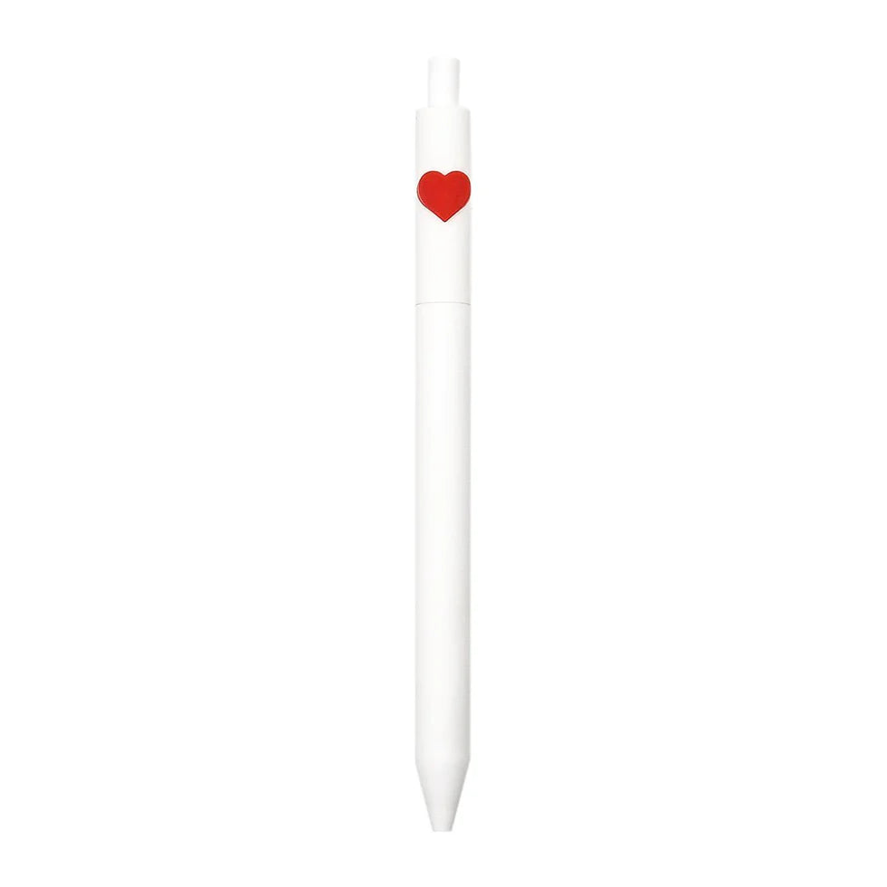 White pen with a red heart-shaped clip on a white background