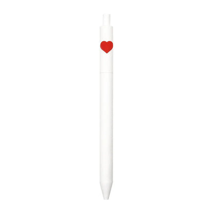 White pen with a red heart-shaped clip on a white background