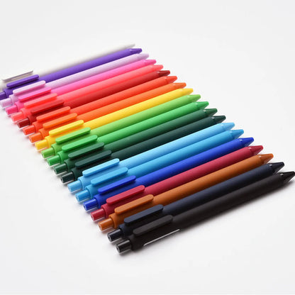 Set of colorful pens arranged in a gradient on a white background