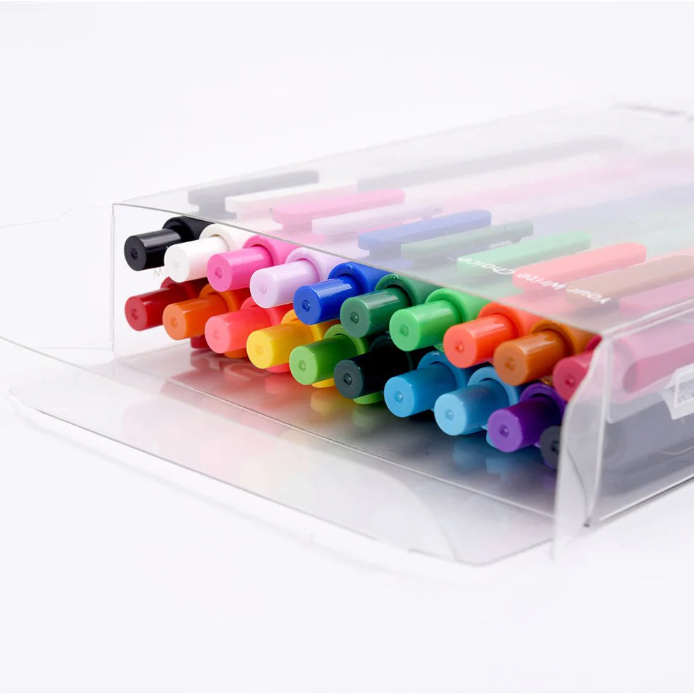 Set of colorful markers in a clear holder on a white background