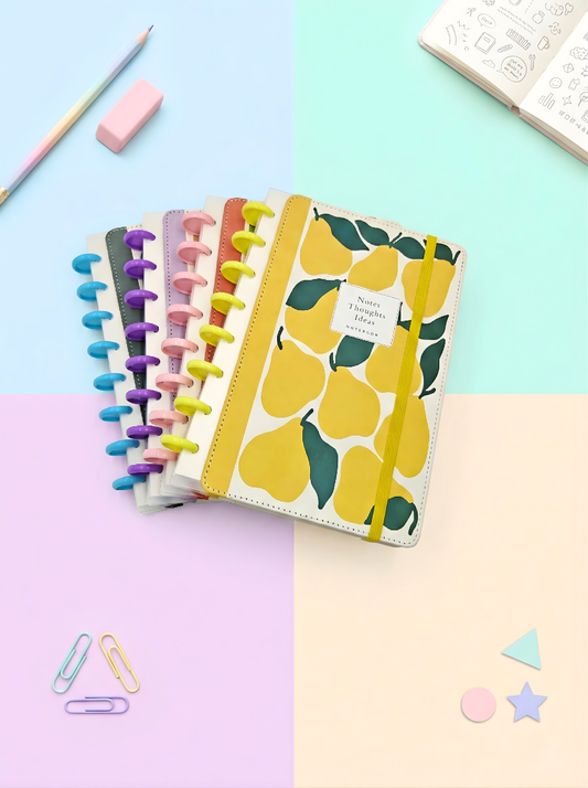 Set of colorful planners with a yellow pear design on a gradient background