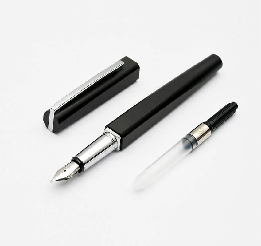 Black fountain pen with silver accents on a white background