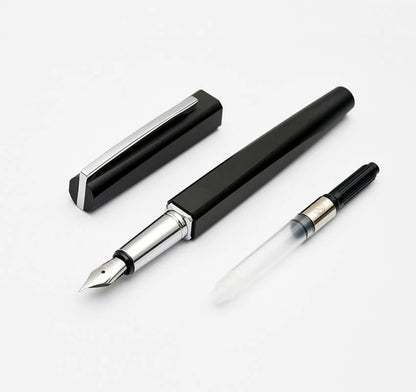 Black fountain pen with silver accents on a white background