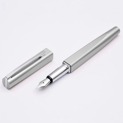 Silver fountain pen and its cap on a white background