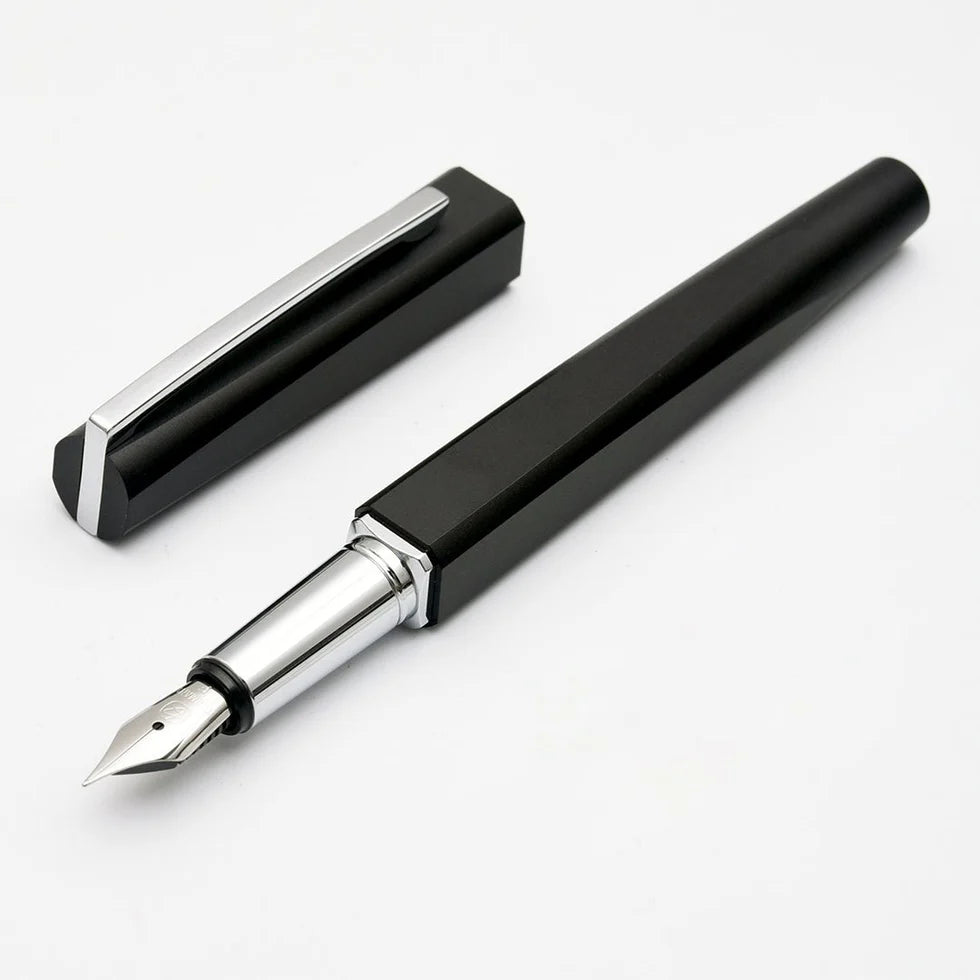 Black fountain pen with silver accents on a white background
