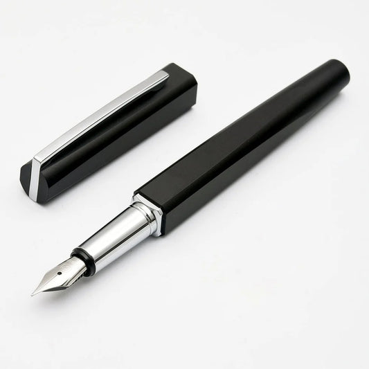 Black fountain pen with silver accents on a white background
