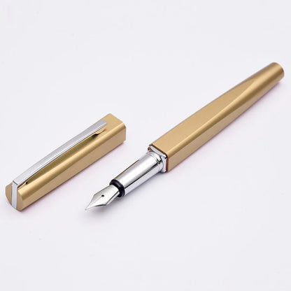Gold and silver fountain pen on a white background