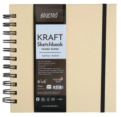 Beige kraft sketchbook with black spiral binding and visible branding on a white background
